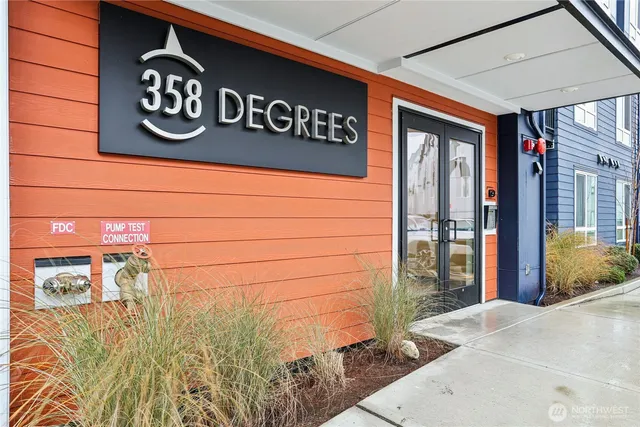 a view of a street sign and a bench