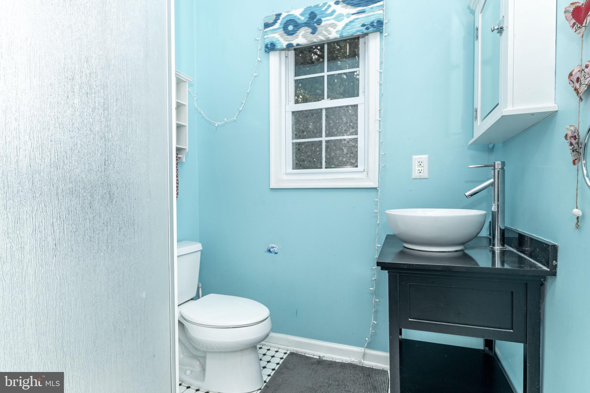 98 Nantucket Trail Medford, NJ 08055 - Photo 21 of 69 a bathroom with a toilet a sink and a window