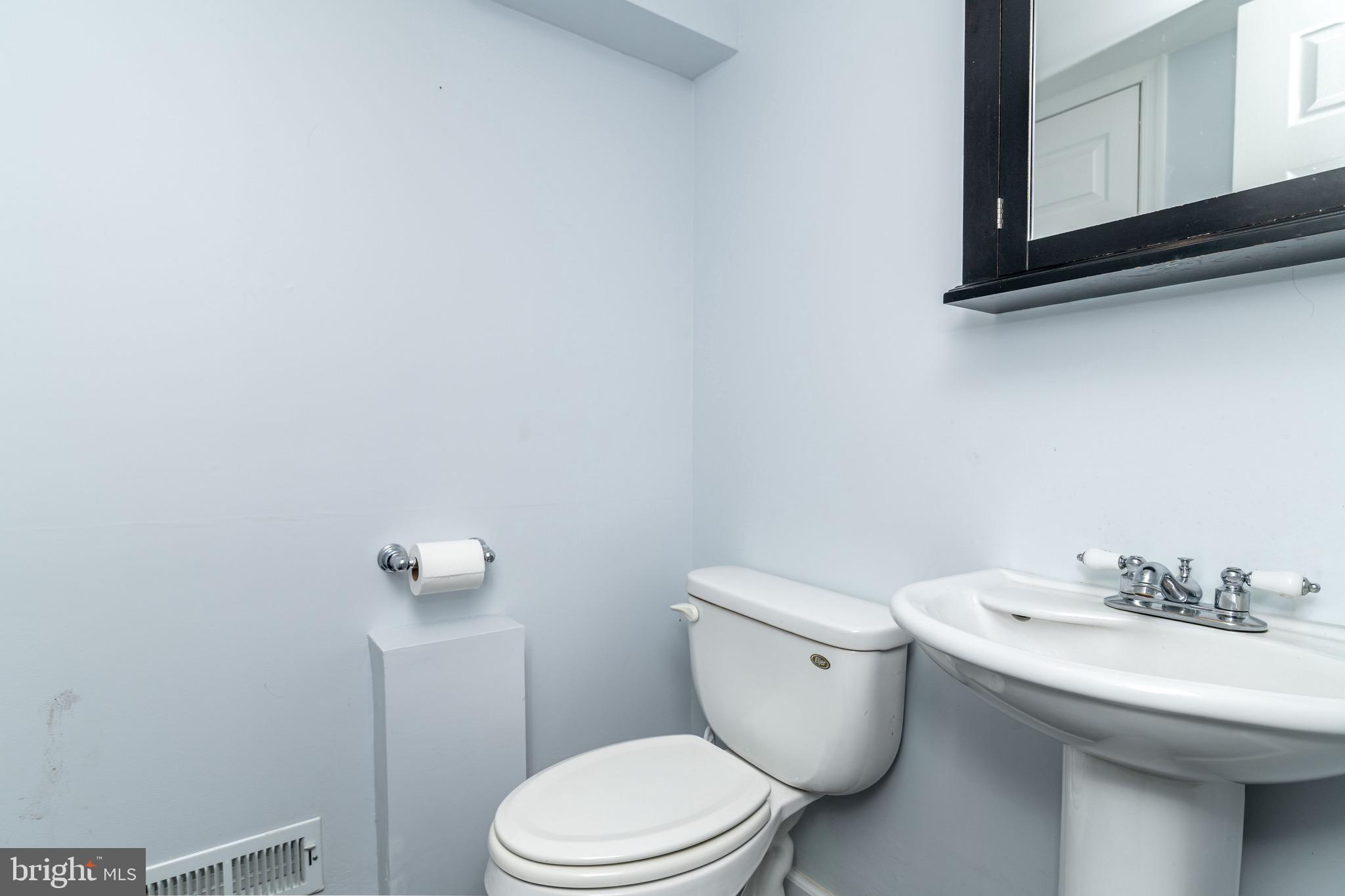 98 Nantucket Trail Medford, NJ 08055 - Photo 38 of 69 a white toilet sitting next to a bathroom sink