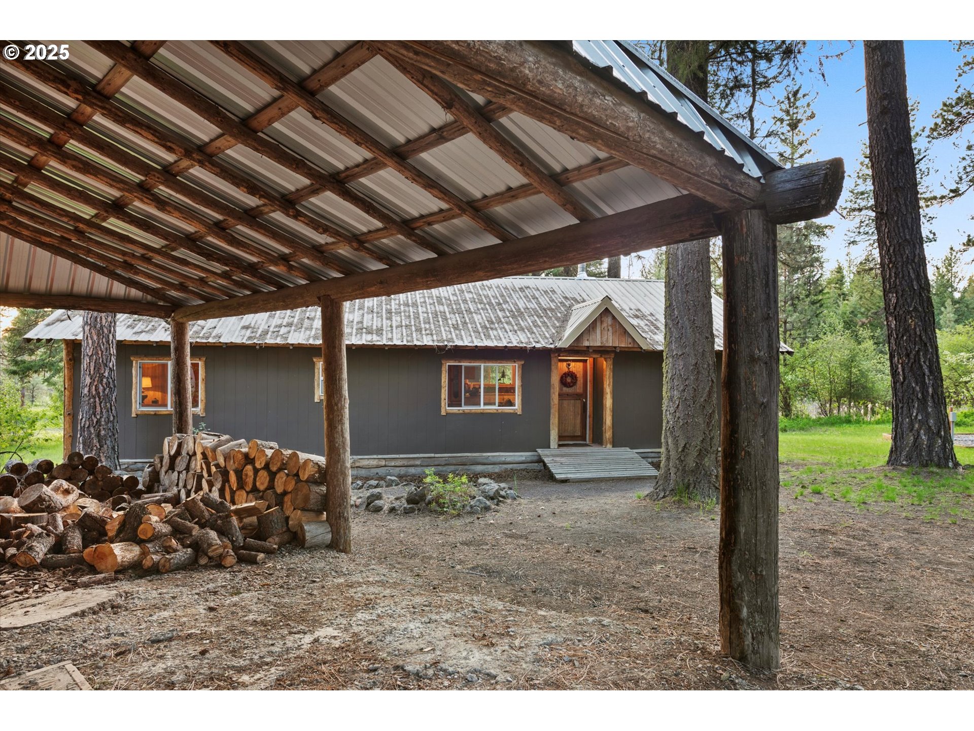 74576 Thompson Road Elgin, OR 97827 - Photo 3 of 47 a backyard of a house with barbeque oven table and chairs