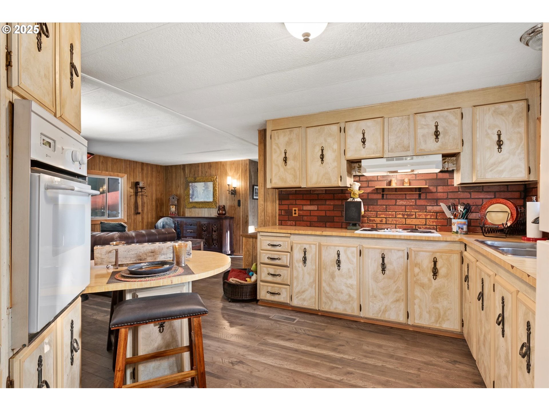 74576 Thompson Road Elgin, OR 97827 - Photo 31 of 47 a kitchen with stainless steel appliances a refrigerator sink and cabinets