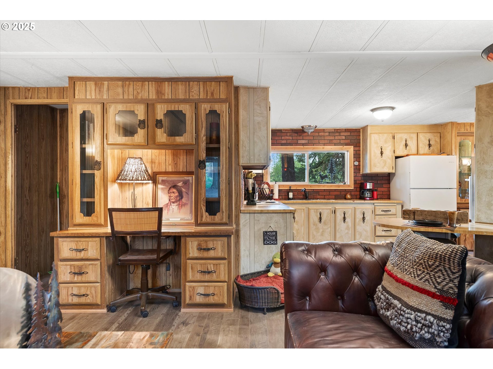 74576 Thompson Road Elgin, OR 97827 - Photo 34 of 47 a living room with furniture a large window and a flat screen tv