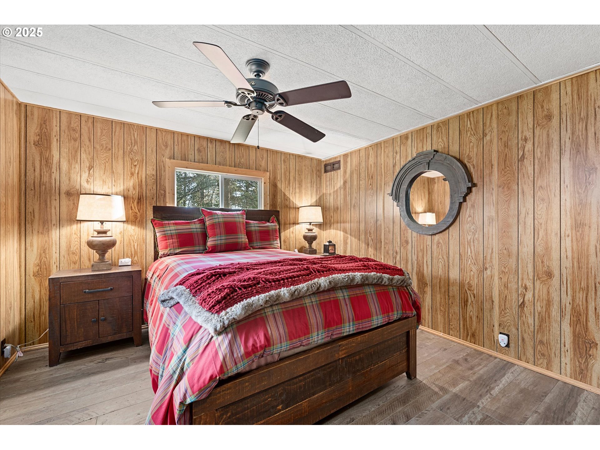 74576 Thompson Road Elgin, OR 97827 - Photo 36 of 47 a bed sitting in a bedroom next to a window