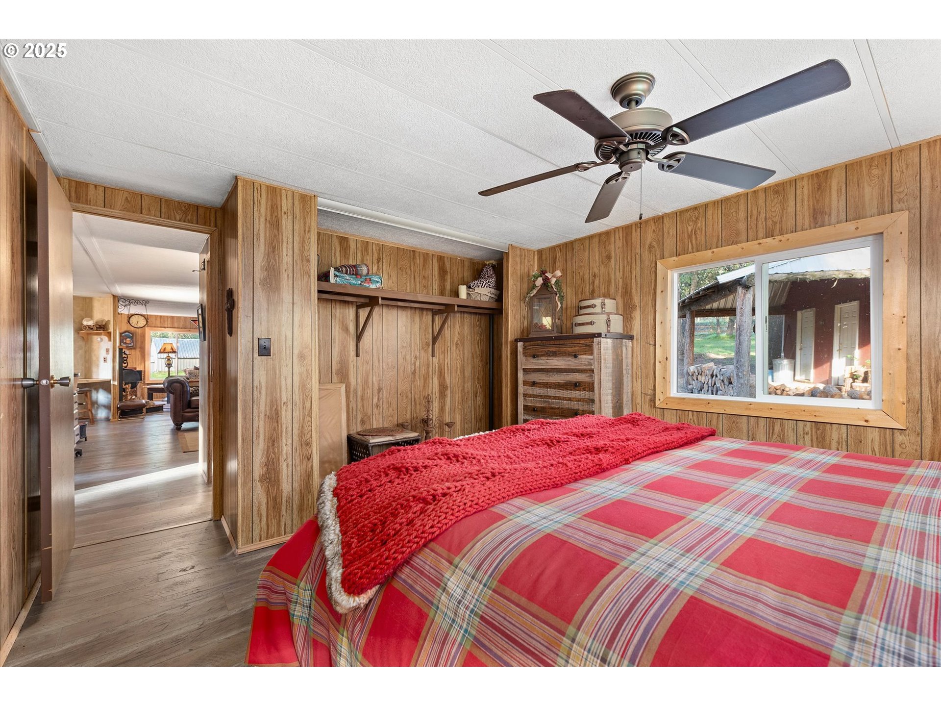 74576 Thompson Road Elgin, OR 97827 - Photo 37 of 47 a bedroom with a bed and a chandelier
