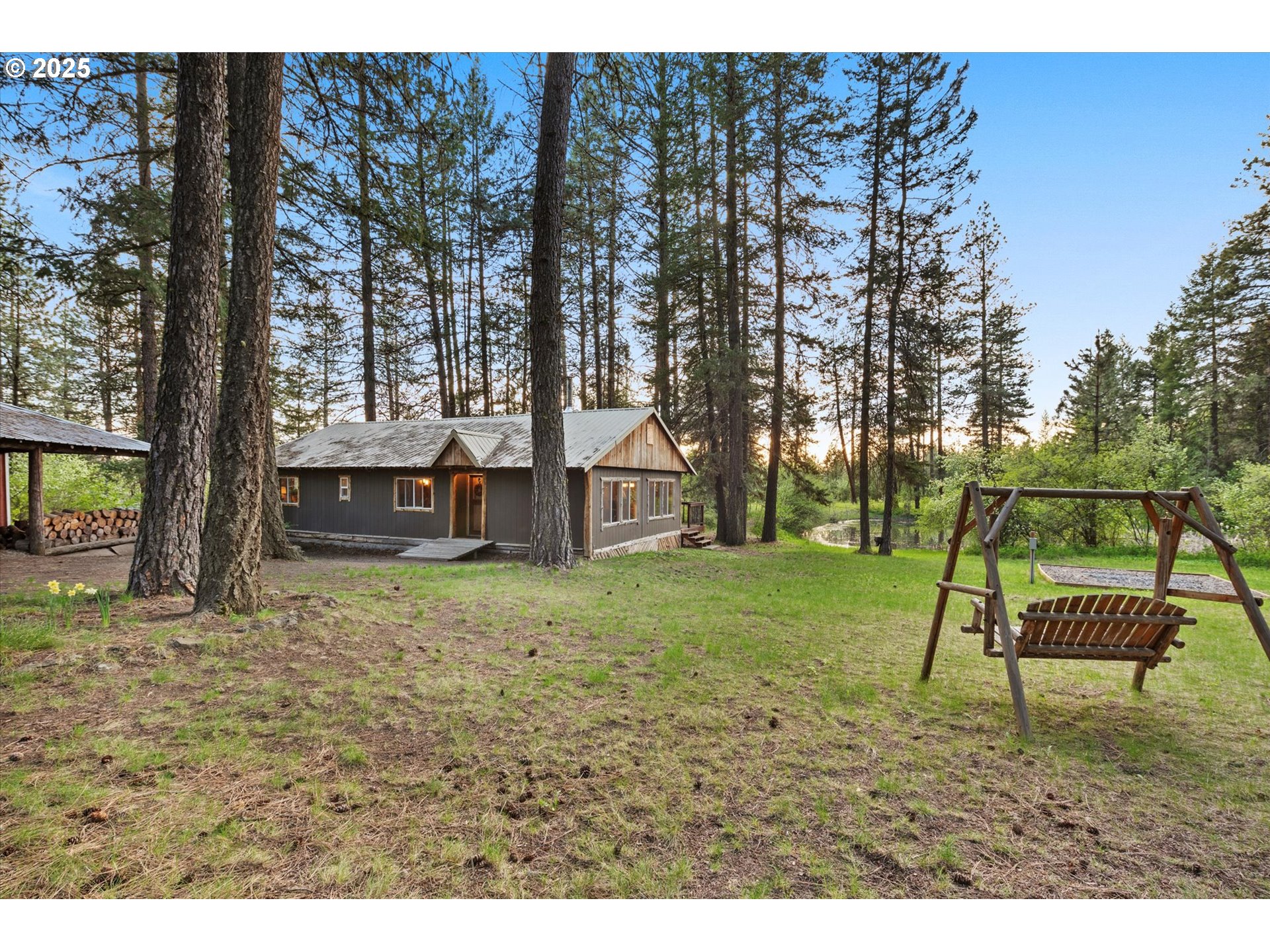 74576 Thompson Road Elgin, OR 97827 - Photo 4 of 47 a backyard of a house with lots of green space