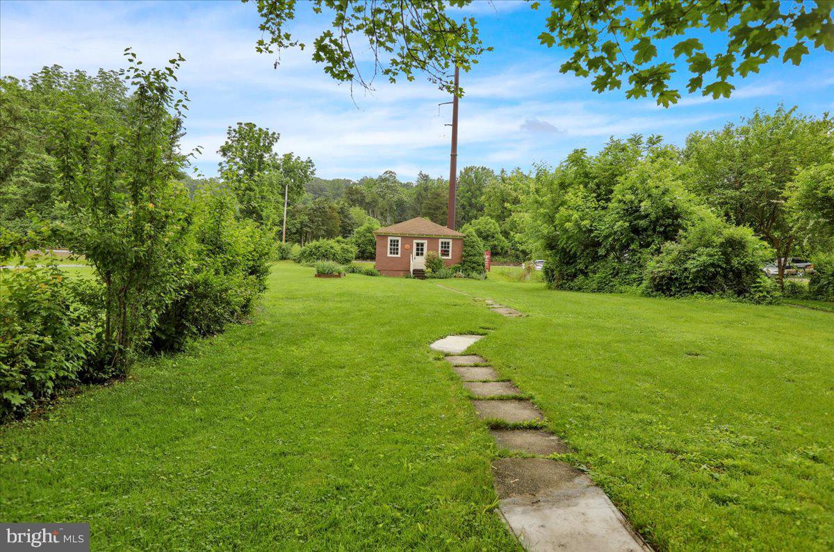 758 Fritztown Road Reading, PA 19608 - Photo 24 of 27 a view of a garden with a building in the background