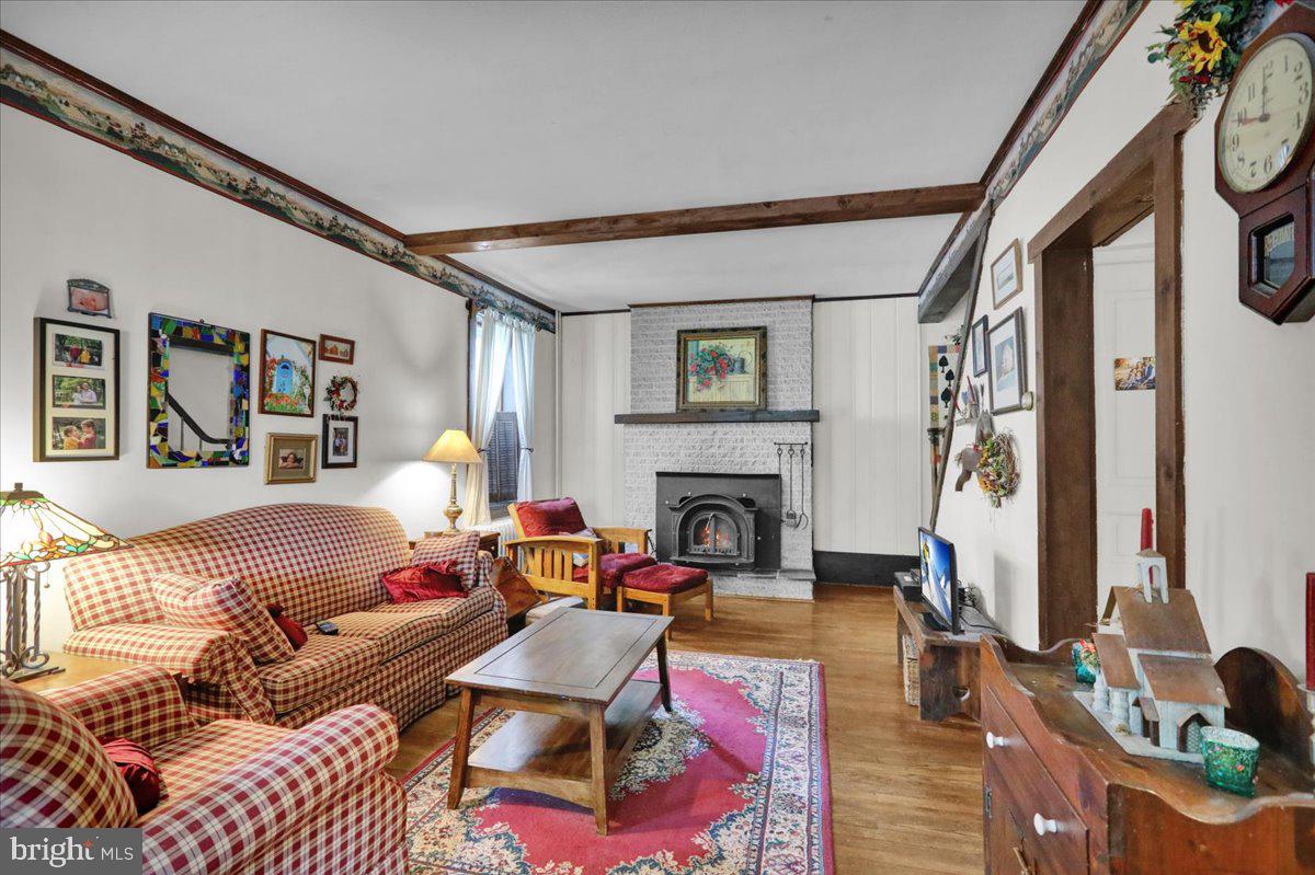 758 Fritztown Road Reading, PA 19608 - Photo 6 of 27 a living room with furniture and a fireplace