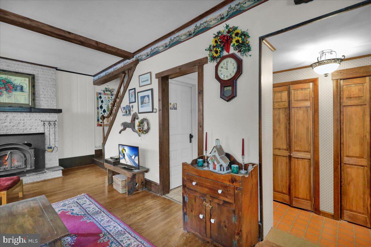 758 Fritztown Road Reading, PA 19608 - Photo 7 of 27 a living room with furniture appliances and a fireplace