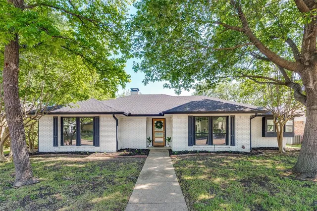 front view of a house with a garden