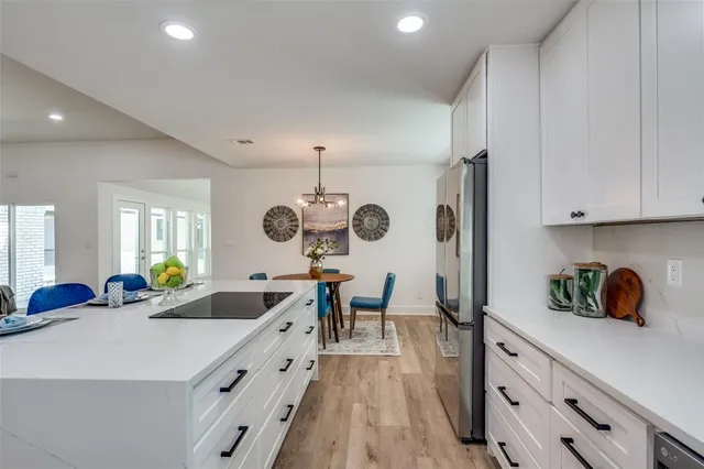 a kitchen with sink cabinets and window