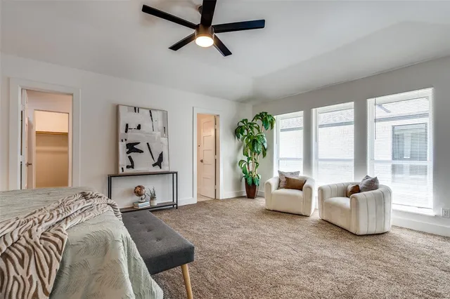 a bedroom with furniture and windows