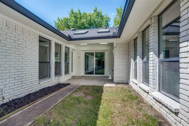 a yellow house with outdoor space