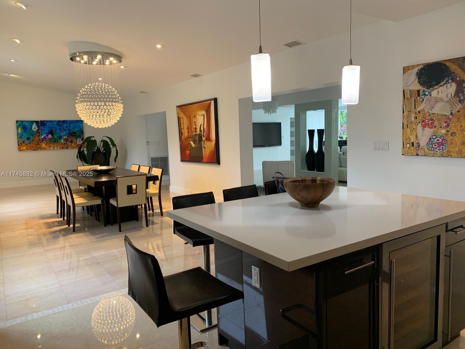 1670 Daytonia Road Miami Beach, FL 33141 - Photo 13 of 24 a view of a dining room with furniture