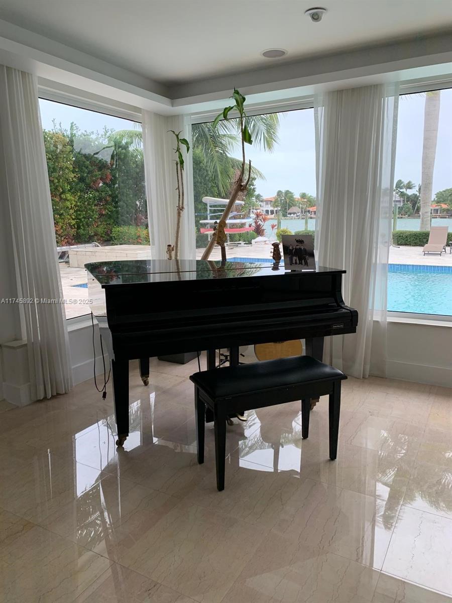 1670 Daytonia Road Miami Beach, FL 33141 - Photo 15 of 24 a view of a room with furniture and window