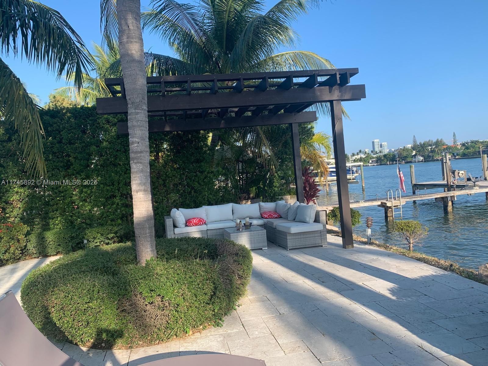 1670 Daytonia Road Miami Beach, FL 33141 - Photo 6 of 24 a view of a couches in patio of the house