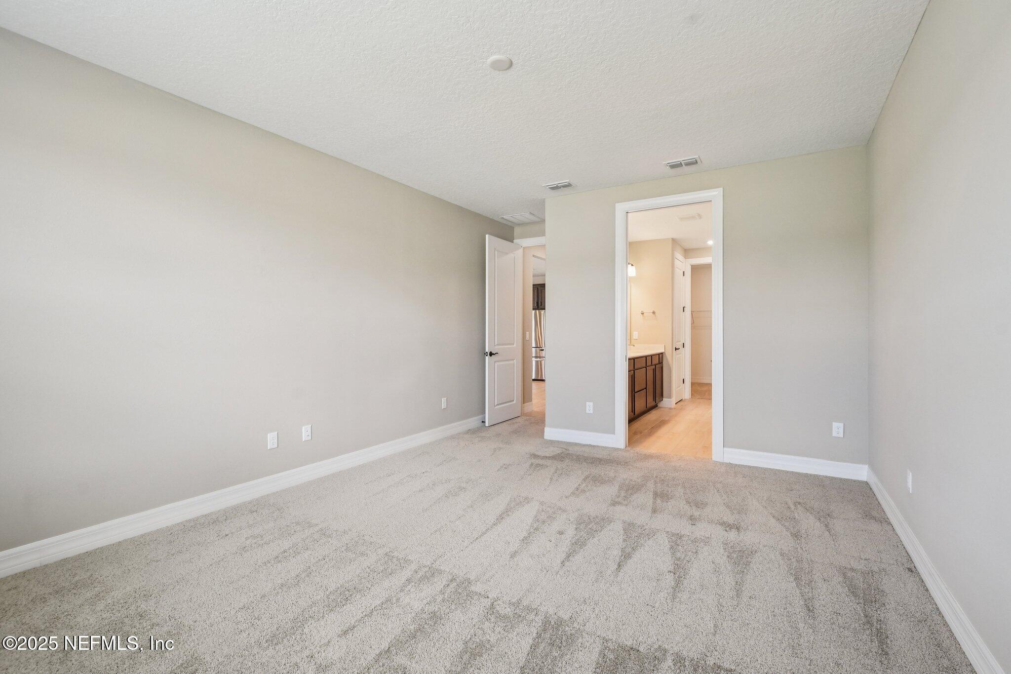 729 Continuum Loop Yulee, FL 32097 - Photo 19 of 31 a view of an empty room