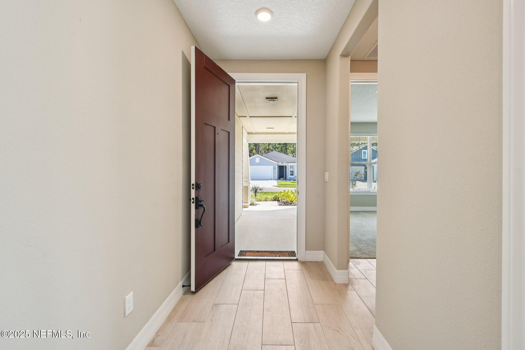 729 Continuum Loop Yulee, FL 32097 - Photo 2 of 31 a view of an entryway of the house