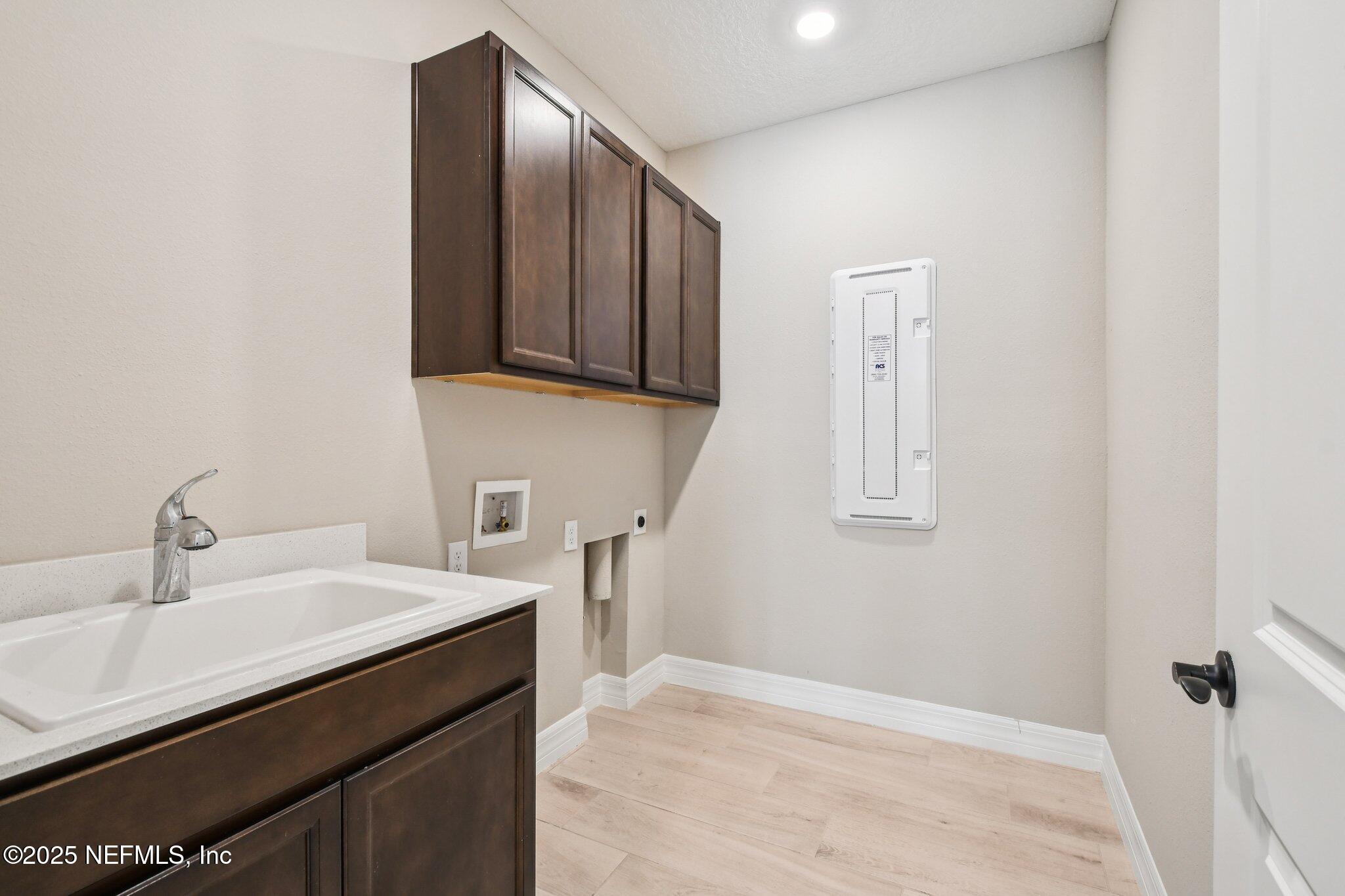 729 Continuum Loop Yulee, FL 32097 - Photo 24 of 31 a bathroom with a sink and a mirror