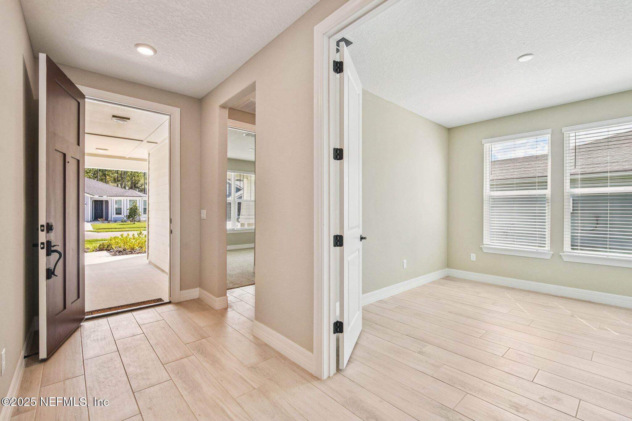 729 Continuum Loop Yulee, FL 32097 - Photo 3 of 31 a view of an empty room and window