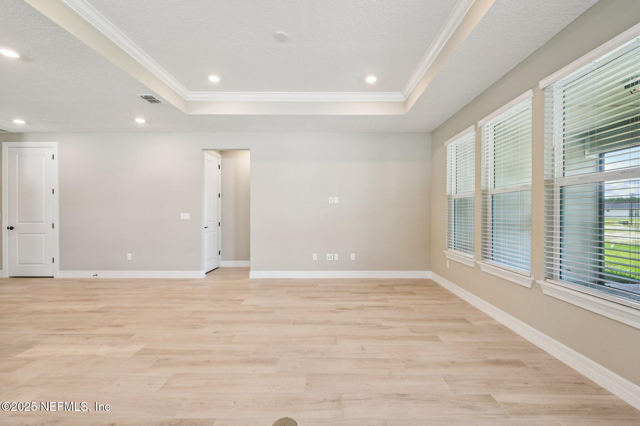 729 Continuum Loop Yulee, FL 32097 - Photo 7 of 31 a view of an empty room with a window