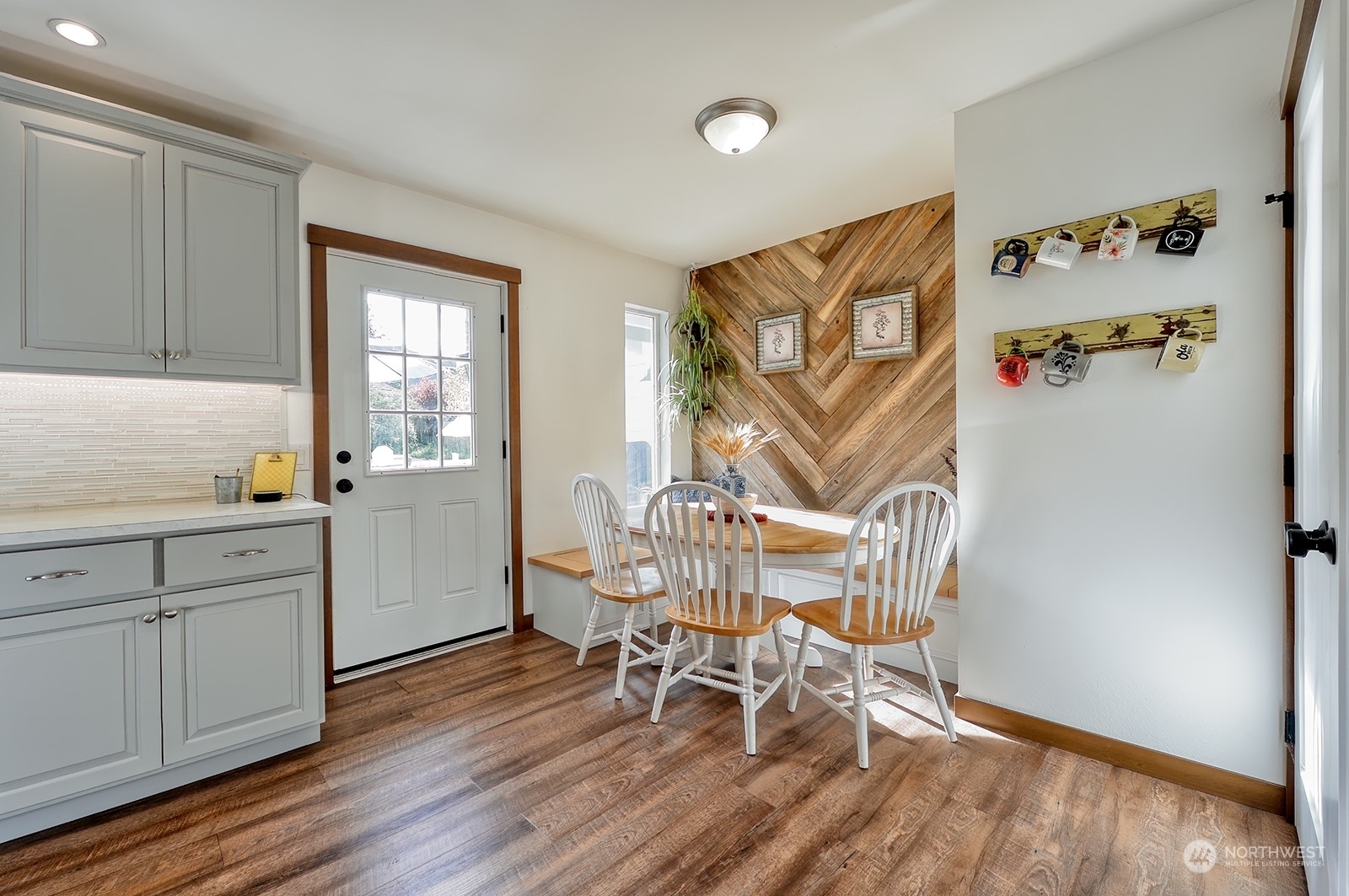 3978 Roma Court Bellingham, WA 98226 - Photo 11 of 38 a view of a kitchen with workspace and wooden floor