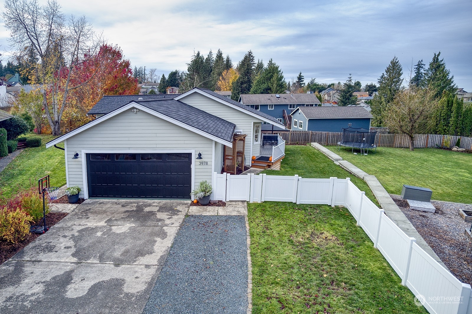 3978 Roma Court Bellingham, WA 98226 - Photo 3 of 38 a front view of a house with a yard and garage
