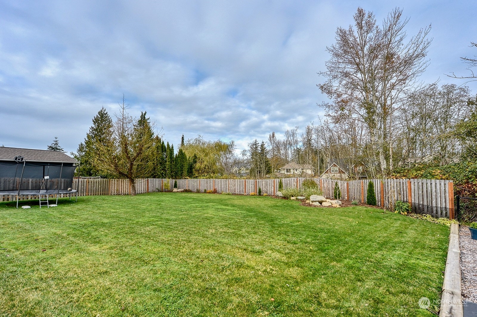 3978 Roma Court Bellingham, WA 98226 - Photo 36 of 38 a view of a yard with a house in the background