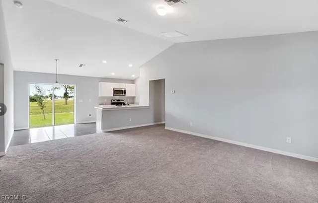 a view of a kitchen with a sink and a kitchen area
