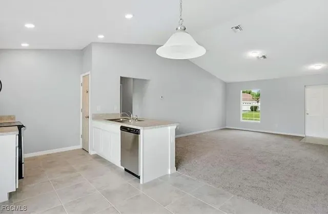 a kitchen with a stove and a refrigerator