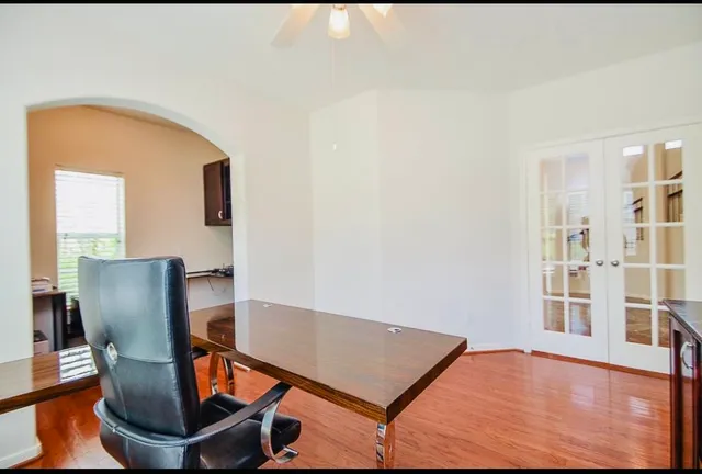 a view of workspace with wooden floor and chair