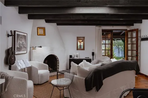 a bedroom with furniture and a fireplace