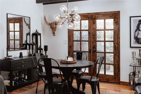 a view of a dining room with furniture and window