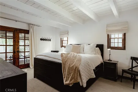 a bedroom with a bed and a table