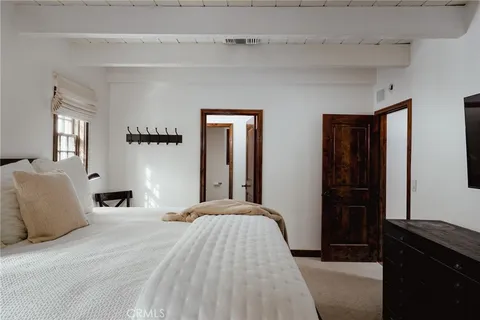 a bedroom with a bed and a walk in closet