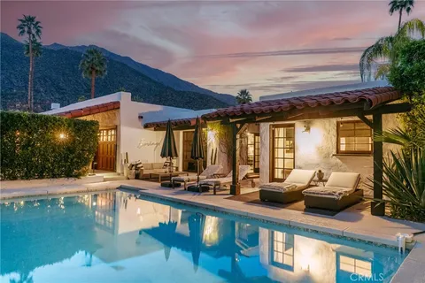a view of swimming pool with outdoor seating