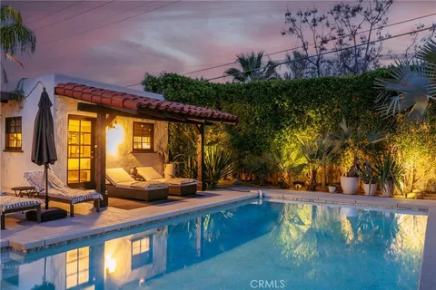 a view of a swimming pool with a yard