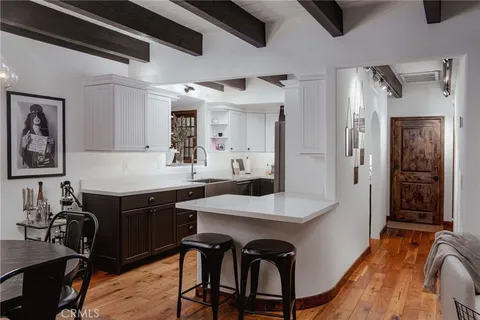 a kitchen with a table and chairs in it