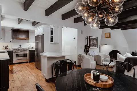 a living room with furniture and a kitchen