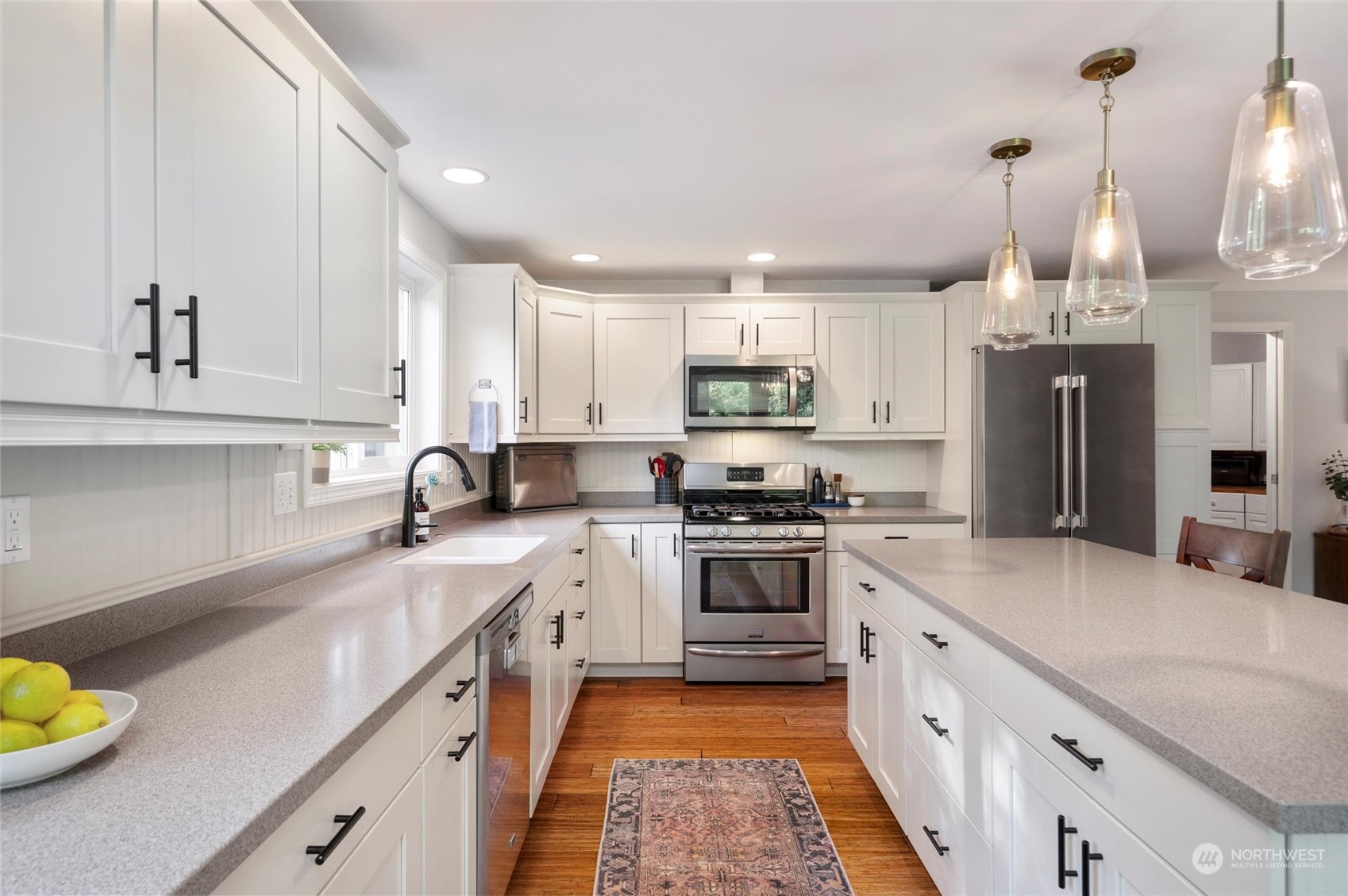 5052 Noon Road Bellingham, WA 98226 - Photo 19 of 40 a kitchen with stainless steel appliances a sink stove and refrigerator