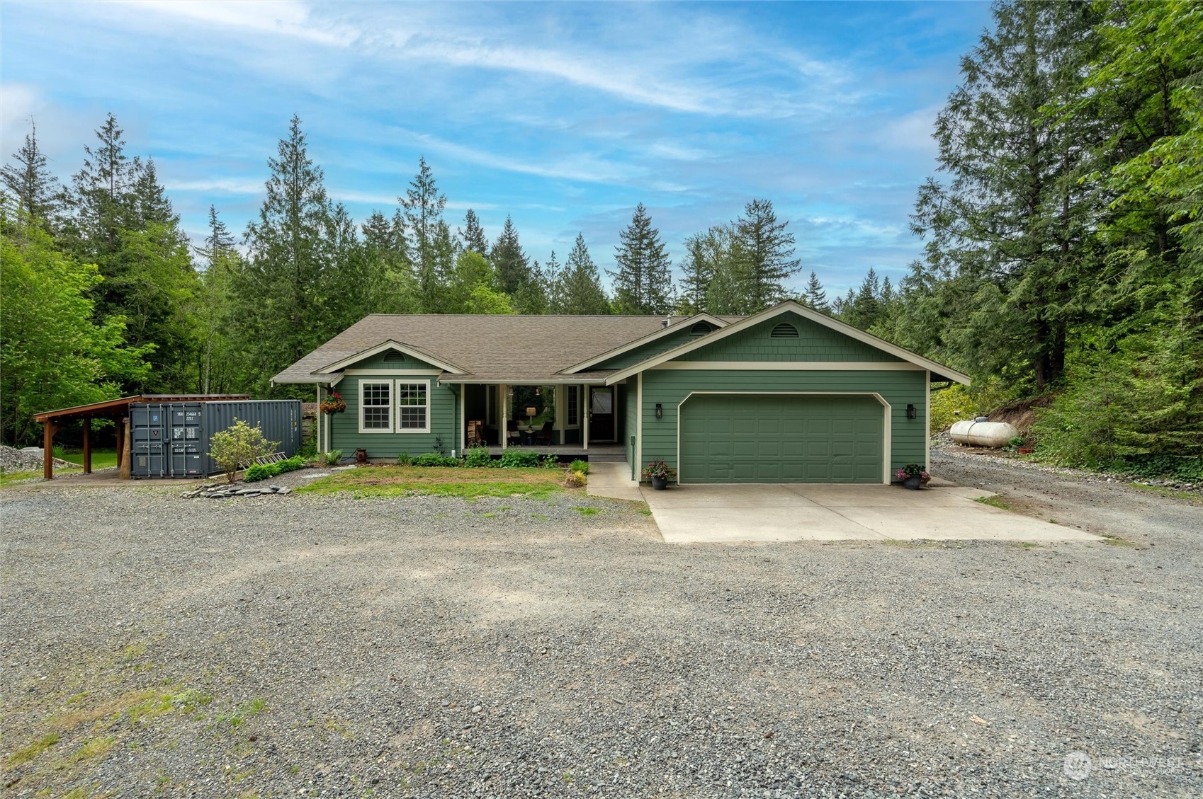 5052 Noon Road Bellingham, WA 98226 - Photo 2 of 40 a front view of a house with a yard and trees