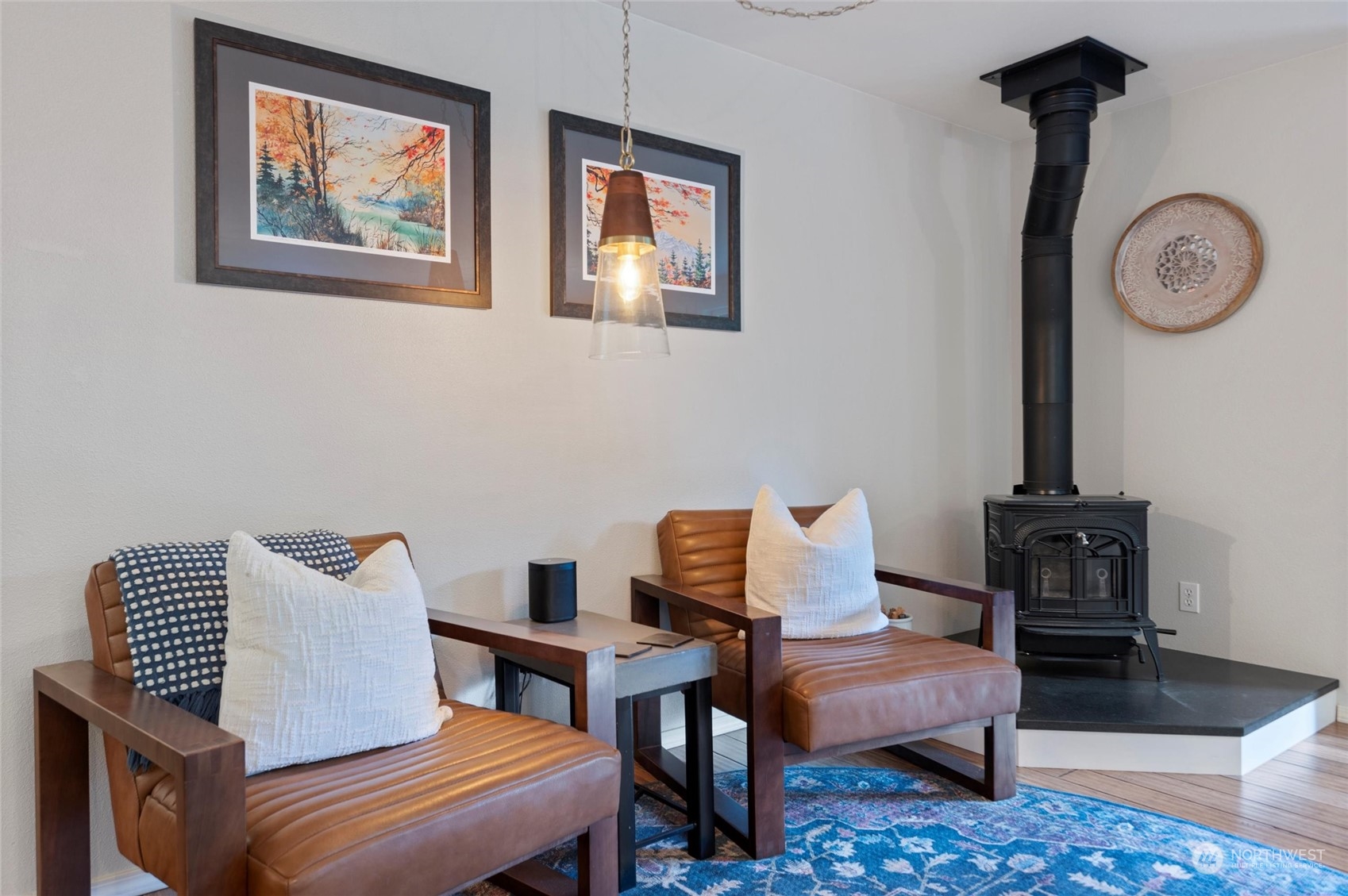 5052 Noon Road Bellingham, WA 98226 - Photo 22 of 40 a living room with furniture a clock on wall and a table