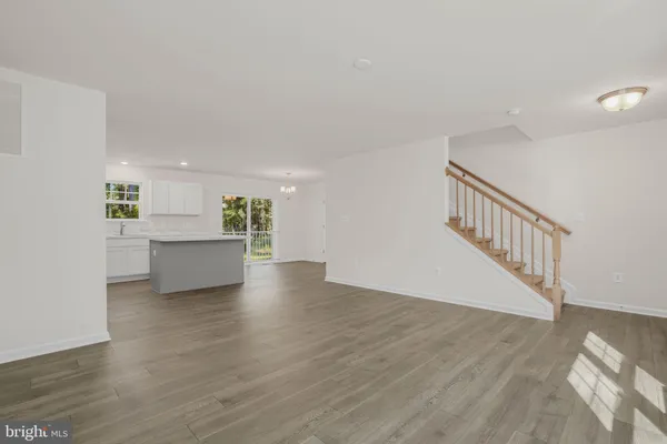 a view of a kitchen with a sink and a microwave