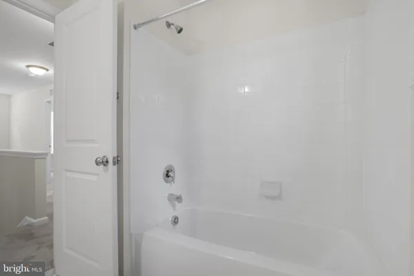 a view of a balcony and yard with furniture