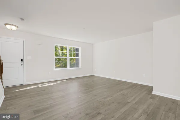 a kitchen with kitchen island a sink stainless steel appliances and window