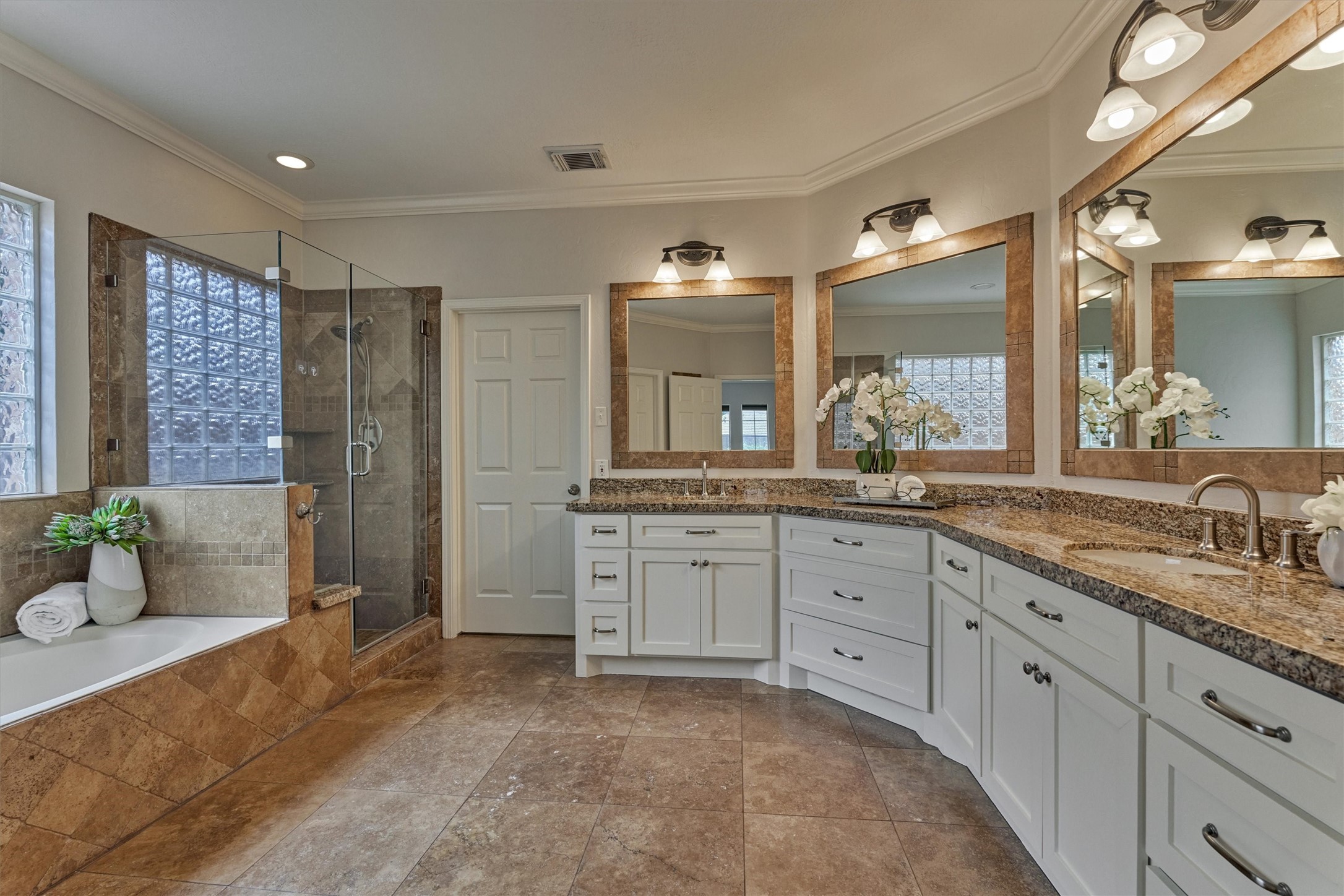 16707 Avenfield Road Tomball, TX 77377 - Photo 21 of 50 a spacious bathroom with a granite countertop sink mirror and shower