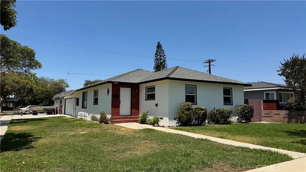 a view of a yard in front view of a house