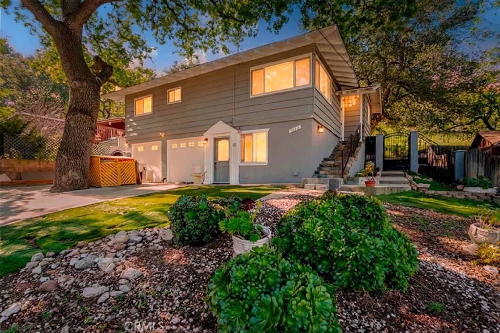 5888 Oak Knolls Road Simi Valley, CA 93063 - Photo 1 of 1 a front view of a house with garden