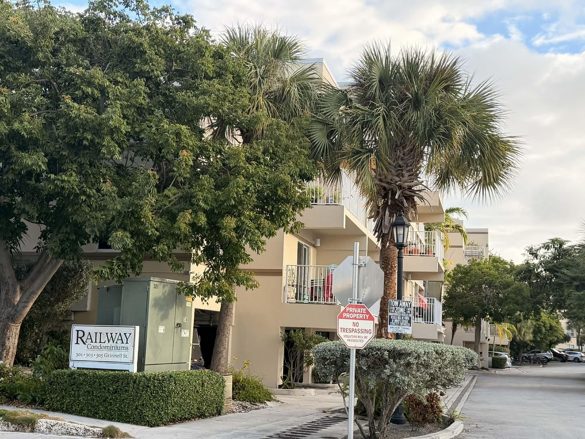 301 Grinnell Street, Unit A401 Key West, FL 33040 - Photo 7 of 8 a front view of a house with a tree