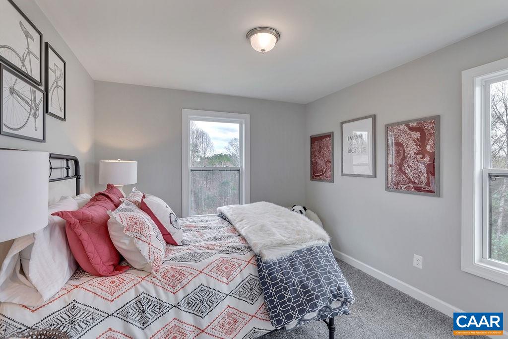 2245 Fowler Street Charlottesville, VA 22901 - Photo 20 of 27 a bedroom with a large bed and a window