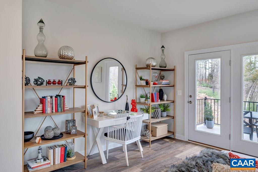 2245 Fowler Street Charlottesville, VA 22901 - Photo 9 of 27 a work room with furniture a rug and a wooden floor